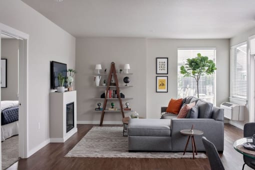 a living room with a fireplace and a couch
