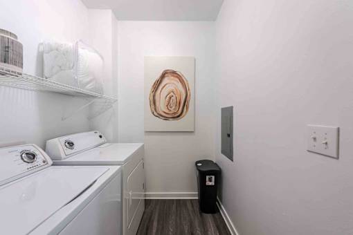 A small laundry room with a washer and dryer at 95twenty Apartments, Austin, Texas