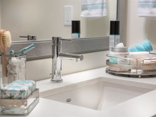 a bathroom with a sink and a mirror at Areum Apartment, Monrovia, 91016  