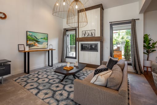 a living room with a couch and a fireplace