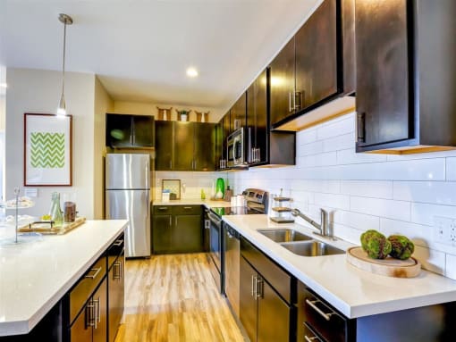 a kitchen with a sink and a refrigerator
