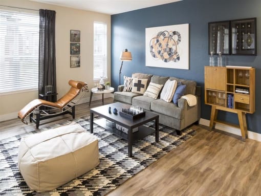 a living room with a couch and a chair
