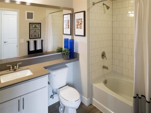 a bathroom with a toilet sink and bathtub