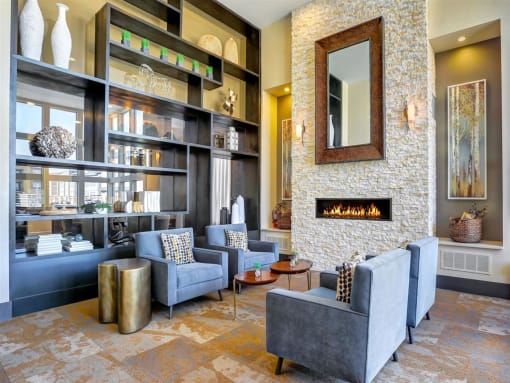 a living room filled with furniture and a fireplace