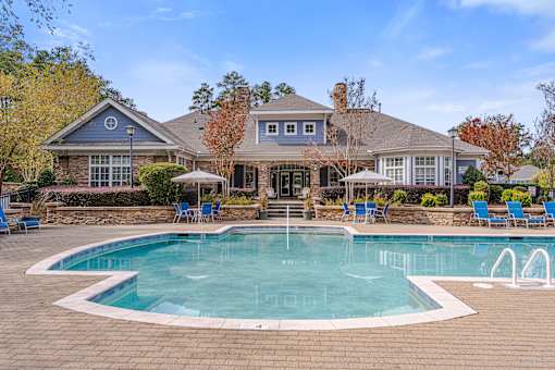 A large house with a pool in the backyard.