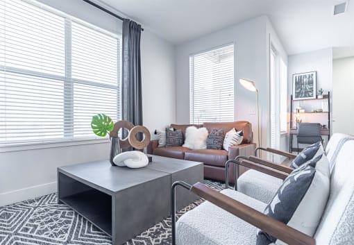 a living room with a leather couch and a coffee table at RockVue, Broomfield, Colorado