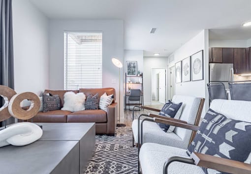 a living room with a couch and two chairs at RockVue, Broomfield, CO