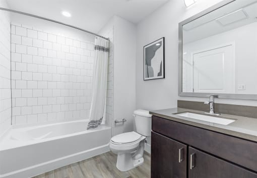 a bathroom with a toilet sink and bathtub at RockVue, Broomfield, CO, 80021