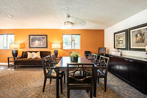 a dining room with a table and chairs at Eagles Landing Apartments, Everett, 98204