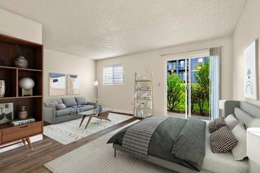 a bedroom with a bed and a couch and a living room at Eagles Landing Apartments, Everett Washington