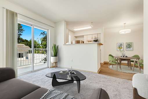 a living room with a couch and a coffee table at Sage Apartments, Everett, WA