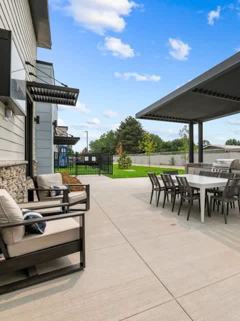 A patio with a table and chairs is shown.