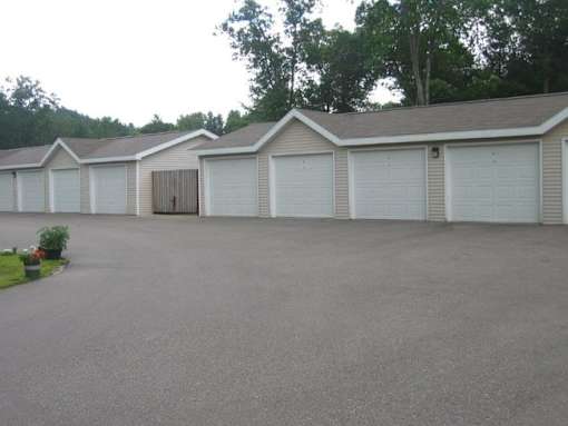 A parking lot with a building in the background.