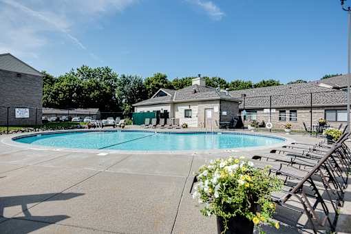 A pool area with a clear blue sky above.