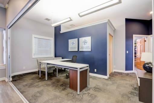 a conference room with a desk and a chair