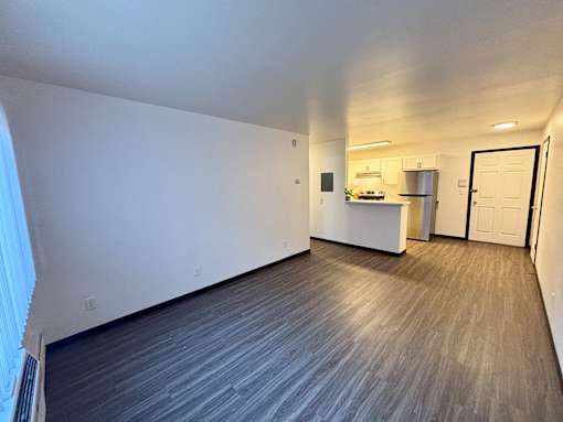 A room with a grey floor and white walls.