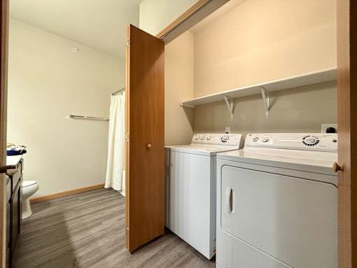 A laundry room with a washer and dryer.