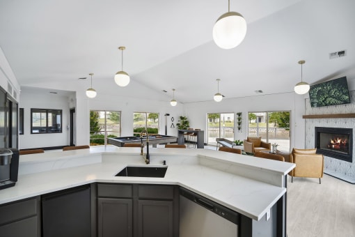 the kitchen is open to the living room and dining room