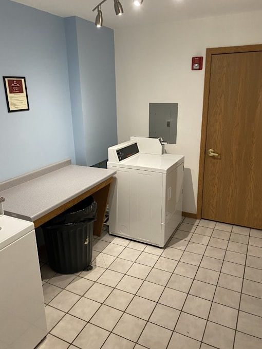 A laundry room with a washer and dryer.