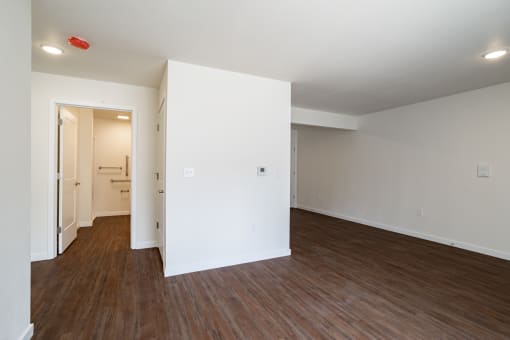 an empty room with a wall of multicolored lights