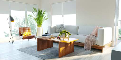 A modern living room with a white sofa, a wooden coffee table, and a red chair.