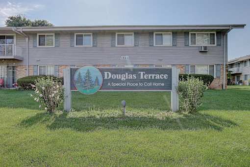 A sign for Douglas Terrace in front of a building.