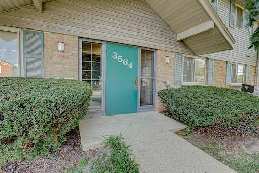 The front door of a house with the number 3564 on it.