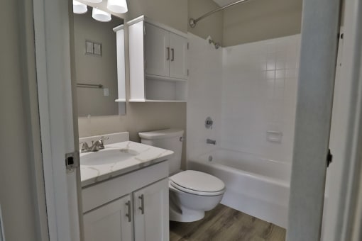 a bathroom with a sink toilet and a shower