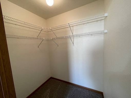 Empty white shelves in a room.