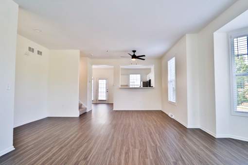 A room with wooden floors and white walls.