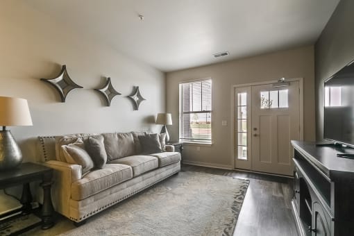 a living room with a couch and a tv