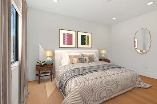 Spacious bedroom in Mar Vista apartment with plank flooring and large windows allowing for gorgeous natural lighting