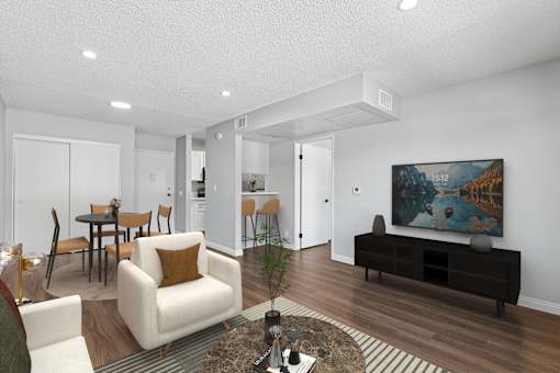 Spacious living area in 1 bed 1 bath Azusa Gardens apartment home with plank flooring and open concept layout leading to dining nook and gorgeous updated kitchen.