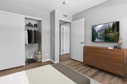 Second bedroom in 2 Bed 1 Bath Azusa Gardens apartment home with wood-style plank, large window and closet.