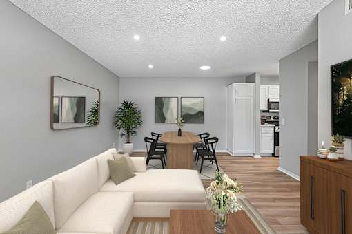 Living area in 2 bed 1 bath Azusa Gardens apartment home which leads into the dining nook and kitchen. Wood-style plank flooring, large windows and open concept layout makes the space feel spacious inviting and serene.