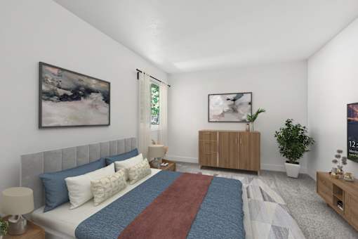 Second Bedroom in 2 Bed 1 Bath Option B Bent Tree Apartment with carpeted flooring and a large window allowing for cozy views of the shady trees and gorgeous natural lighting to filter into the space.