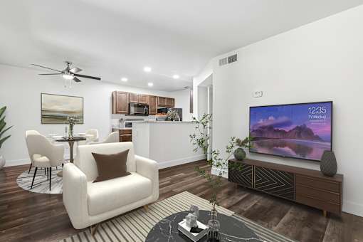 Living Room in 2 Bed 1 Bath Option B Bent Tree apartment with wood plank-style flooring, and an open concept layout leading to the dining nook and kitchen