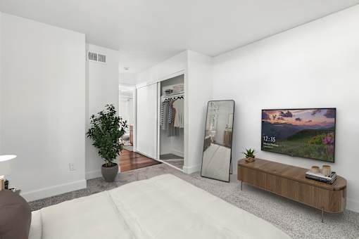 Additional View of Bedroom in 2 Bed 1 Bath Option B Bent Tree Apartment with plush carpeted flooring and a spacious closet