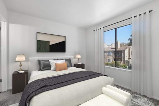 Bedroom 1 in 2 Bedroom California Place apartment home with carpeted flooring and large window allowing for gorgeous natural lighting