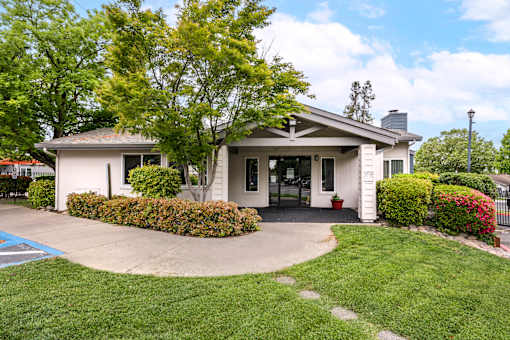 Leasing Office at Bent Tree Apartments surrounded by large trees