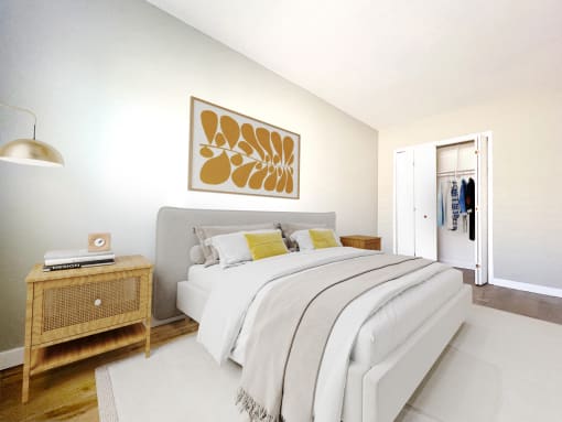 a bedroom with a white bed and a painting on the wall