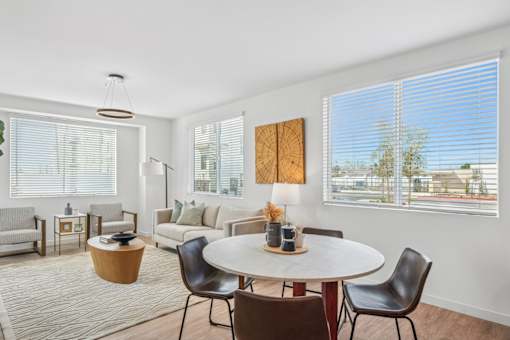 Bright dining and living space with modern furniture at Altitude Apartments, Moreno Valley, California