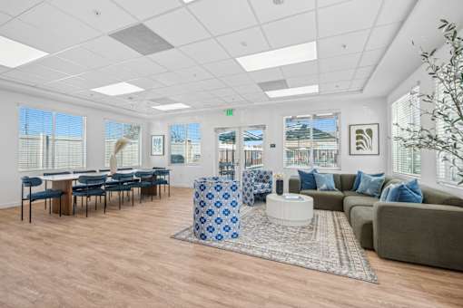 Community clubhouse with dining and lounge areas at Altitude Apartments, California, 92553
