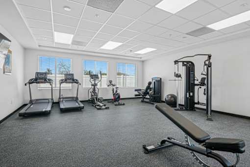 Fitness center with cardio and strength equipment at Altitude Apartments, Moreno Valley