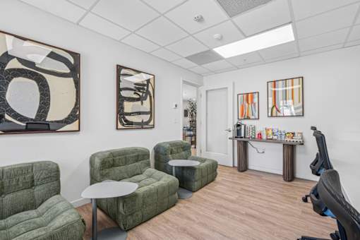 Comfortable lounge area with green modular seating at Altitude Apartments, Moreno Valley, 92553