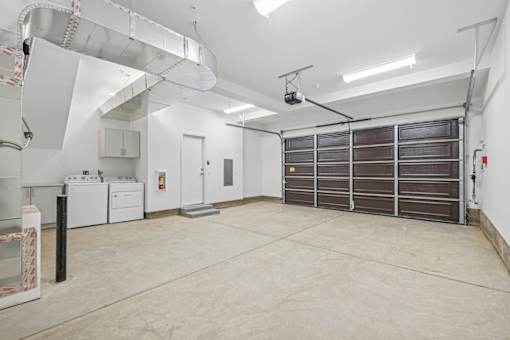 Spacious garage with washer dryer and storage at Altitude Apartments, Moreno Valley, California