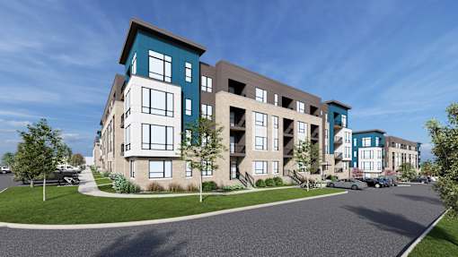 A modern apartment complex with a mix of blue and beige colors.