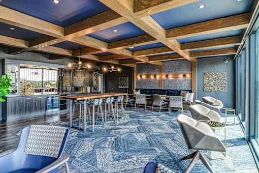A large room with a long table and chairs.