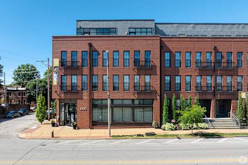 a red brick building on the corner of a street at 1400 Russell Apartments, Saint Louis, Missouri