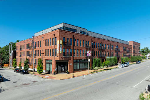 a large brick building on the corner of a street at 1400 Russell Apartments, Saint Louis, MO